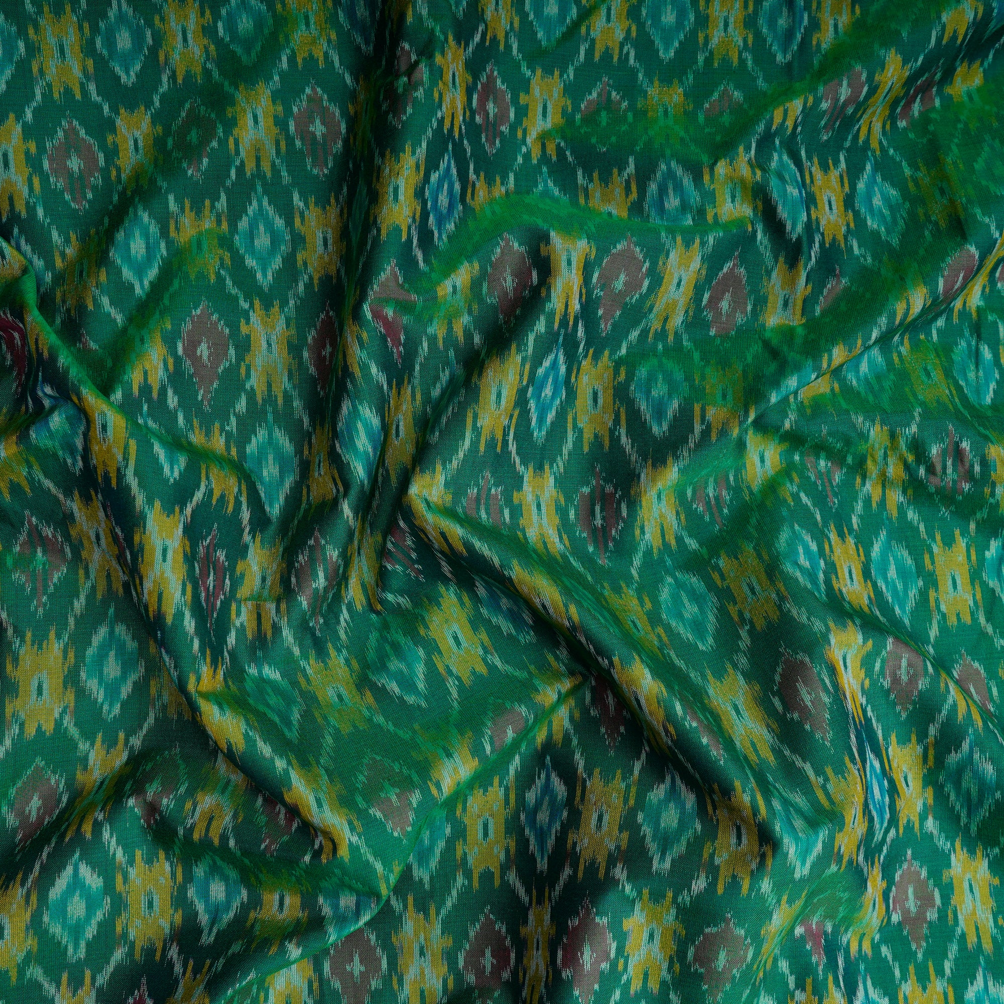 Dark Green Handwoven Pure Silk-Cotton (Sico) Ikat Fabric